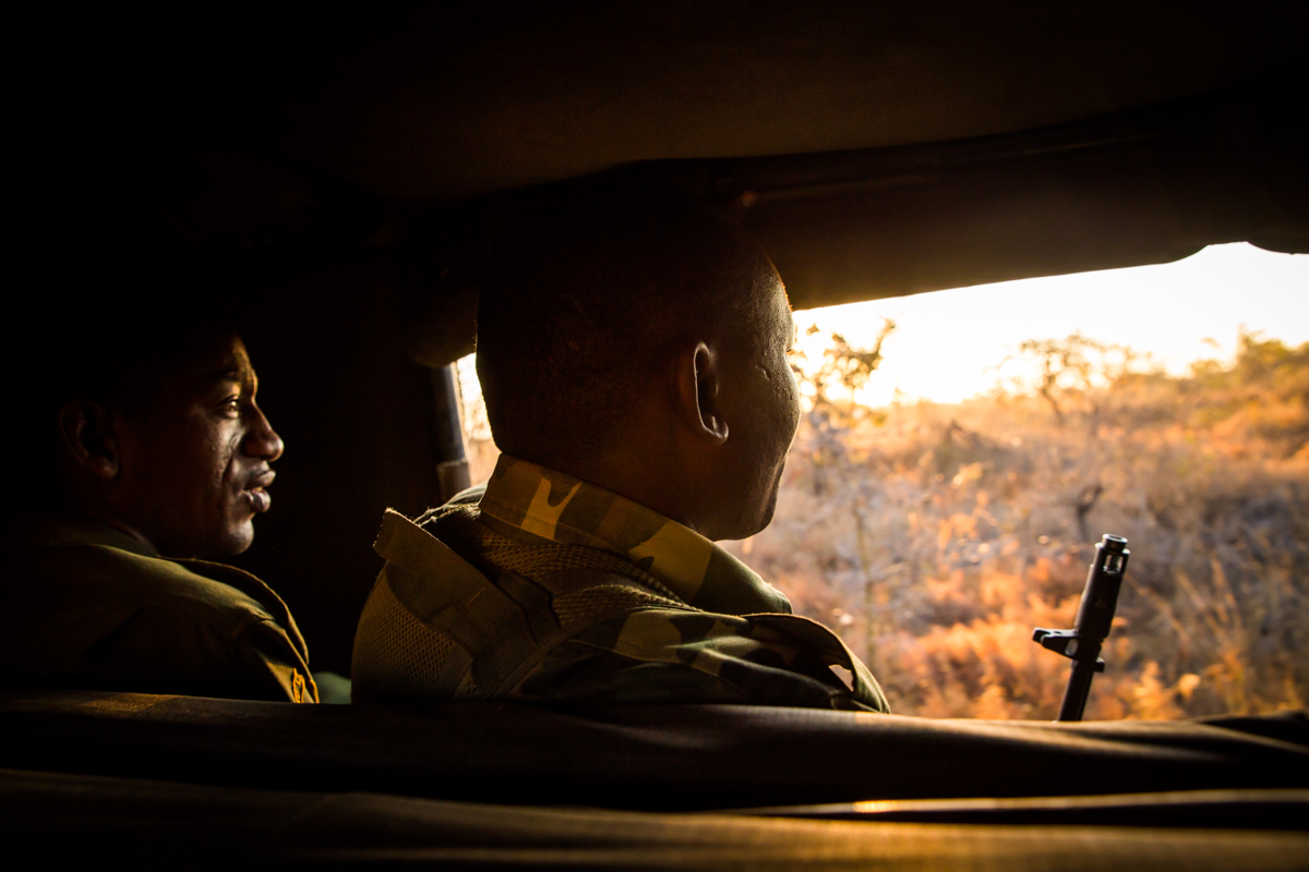 Rangers in vehicle on search for Bahati the rhino.
