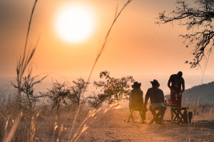Sunset drinks overlooking the savannah, Chyulu Hills, Kenya