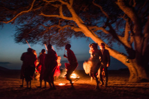 Dancing around the fire as the sun sets